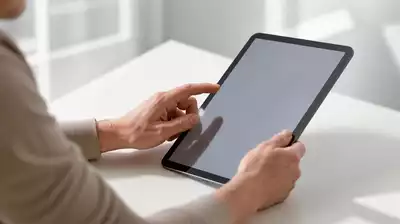 User submitting online form on tablet
