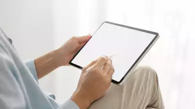 User submitting online form on tablet
