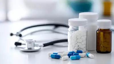 Antiviral medication on a table with a stethoscope